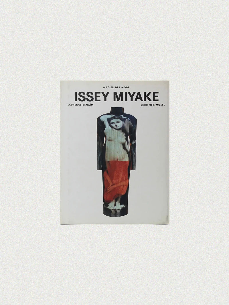 The cover of the "Issey Miyake Book" from Boga Avante Shop, authored by Laurence Benaïm, features a stylized image of a person in layered clothing that highlights contemporary fashion and pleating techniques, with the title and author's name prominently displayed at the top.