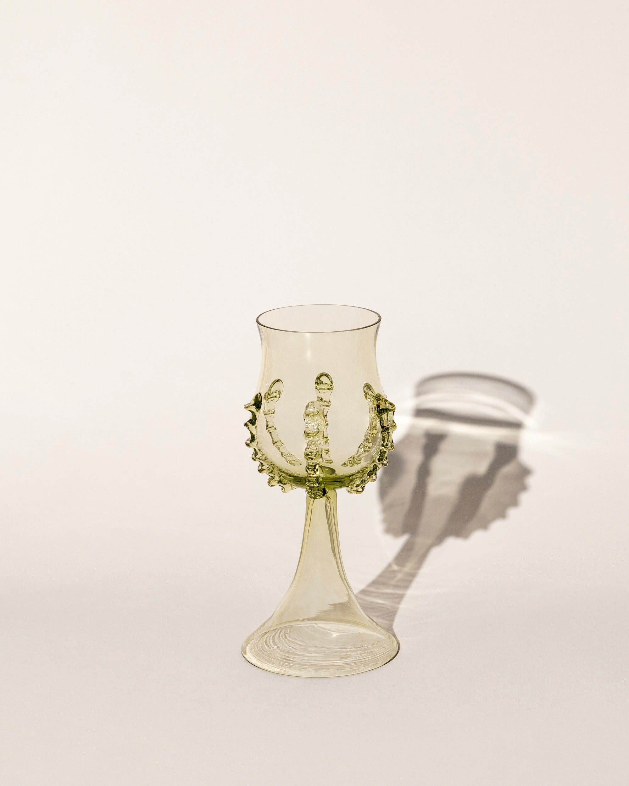 Mouthblown wine goblets with a ribbed design, perfect for elegant dining