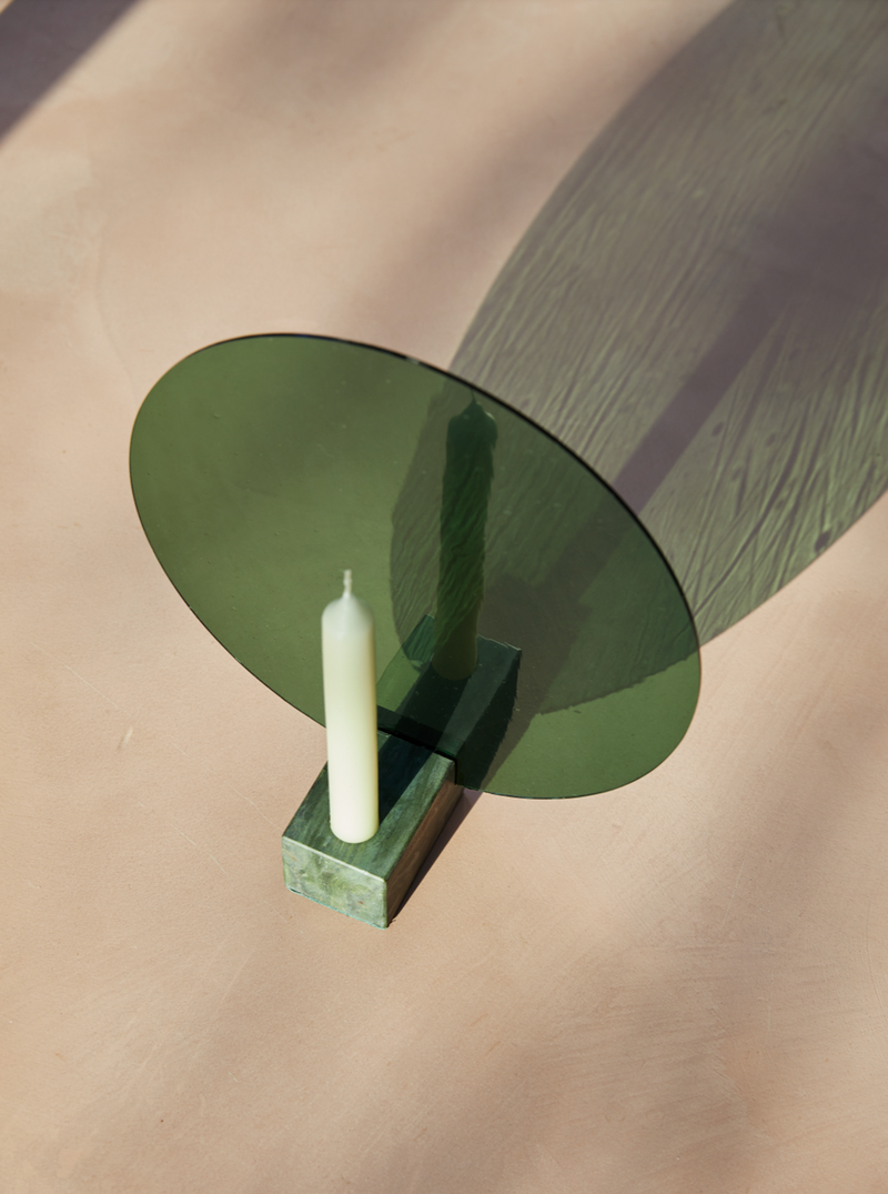 Close-up of a hand wearing Aureool Green nail polish with a glossy effect