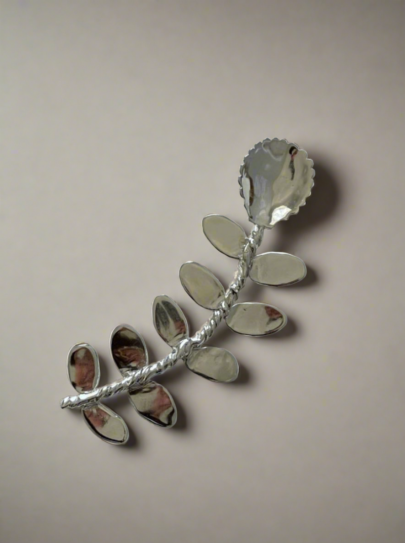 Corali Babette Compote Spoon, artistically handcrafted into a floral shape with a detailed stem and petals, displayed against a plain white background.