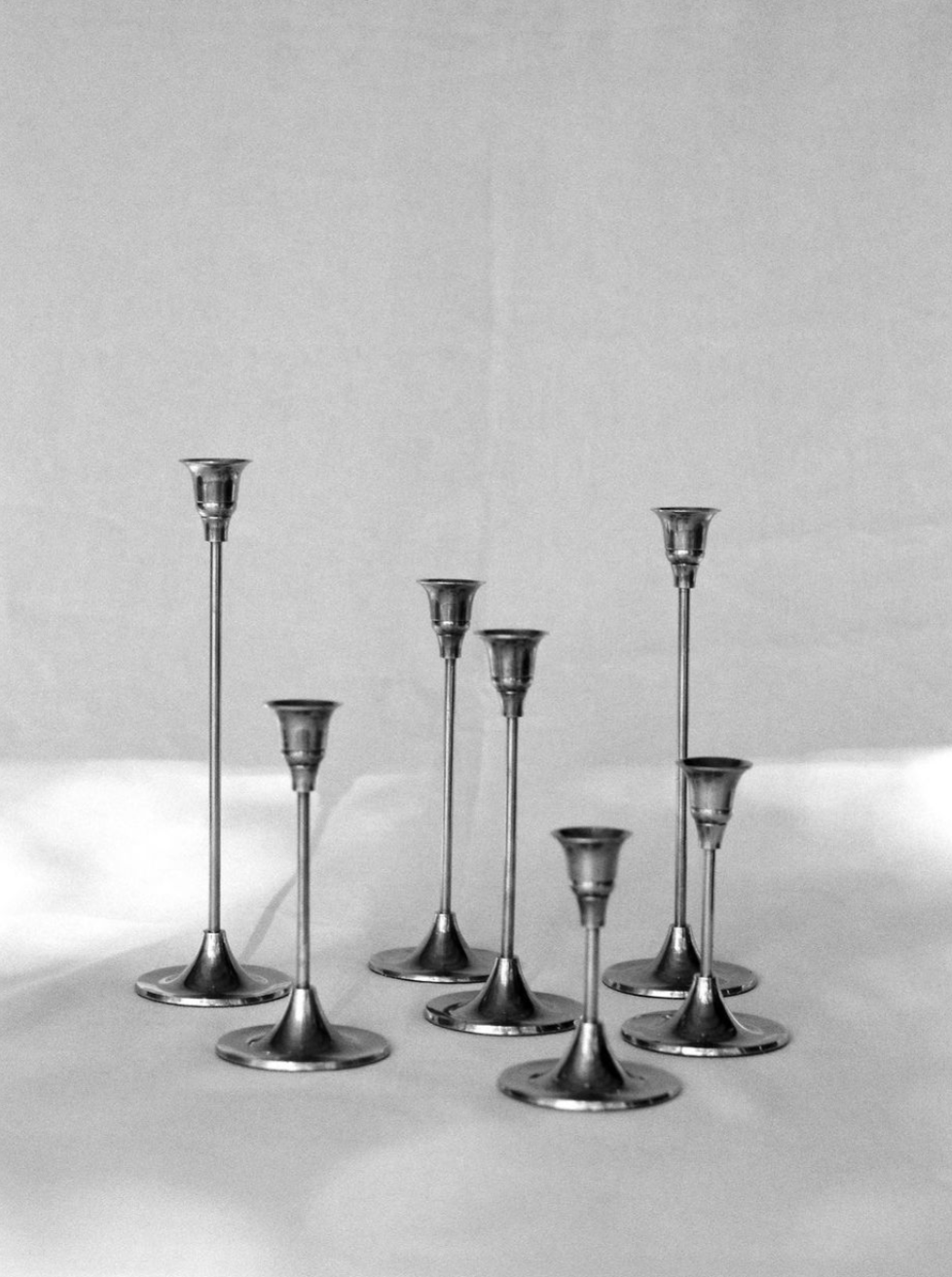 Silver candlestick set with intricate floral design and polished finish