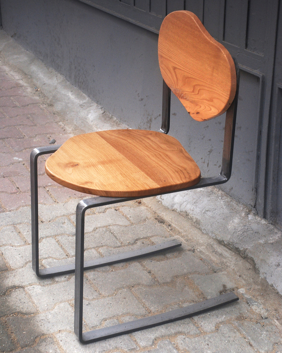 Carmen cantilever chair chestnut wood seat steel frame by ZAROLAT