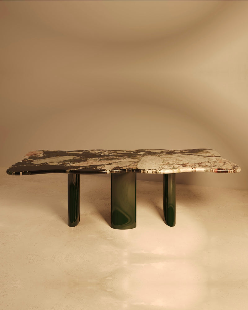 MOJE marble dining table with green cylindrical legs by VandaVee