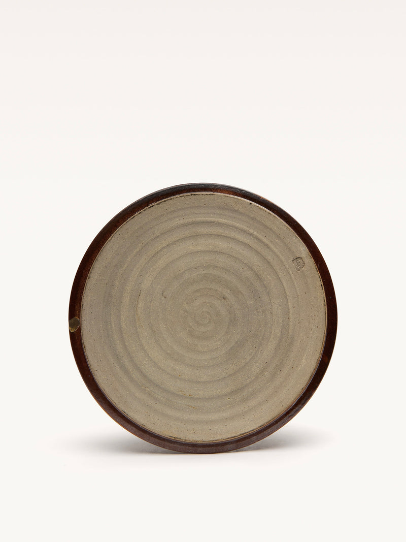The Galerie MLS Ceramic Bowl has a concentric pattern in an art deco style with a dark brown rim, a lighter spiral design at the center, and a plain white background.
