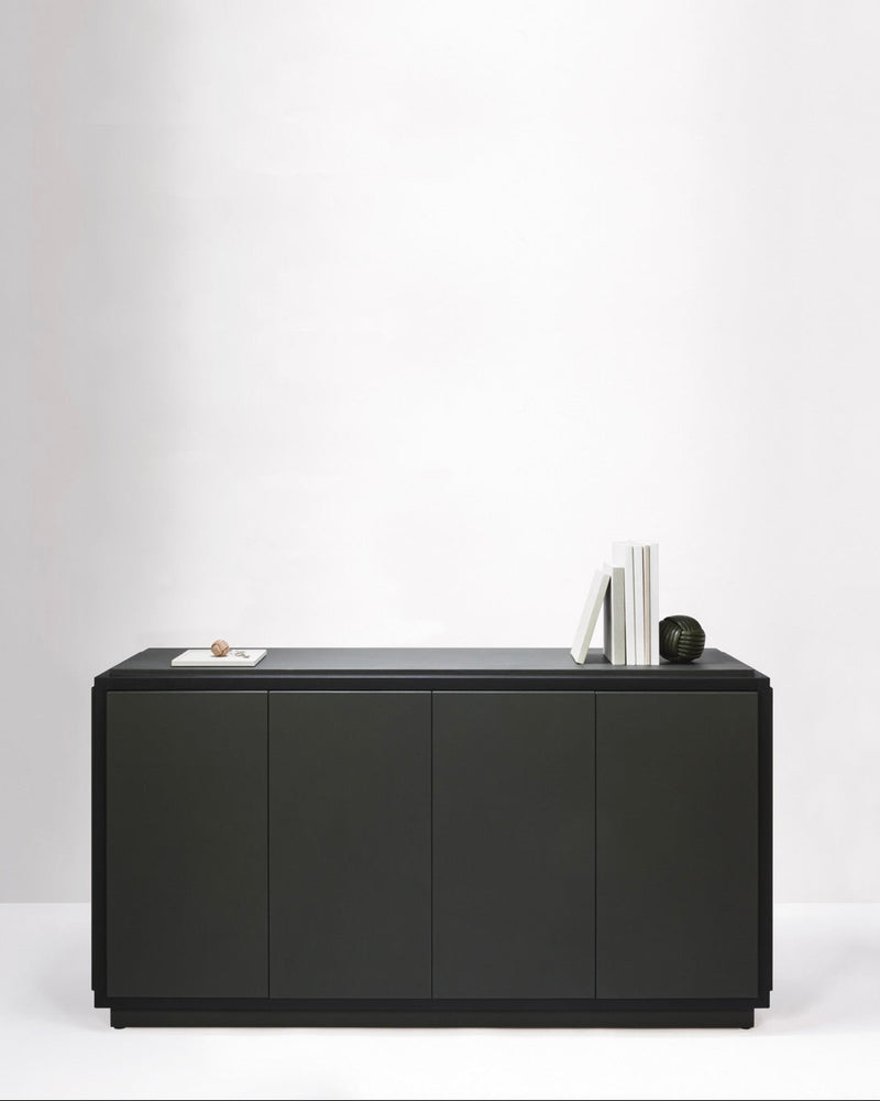 Black Vittoria sideboard with 4 doors by Giobagnara in minimalist setting