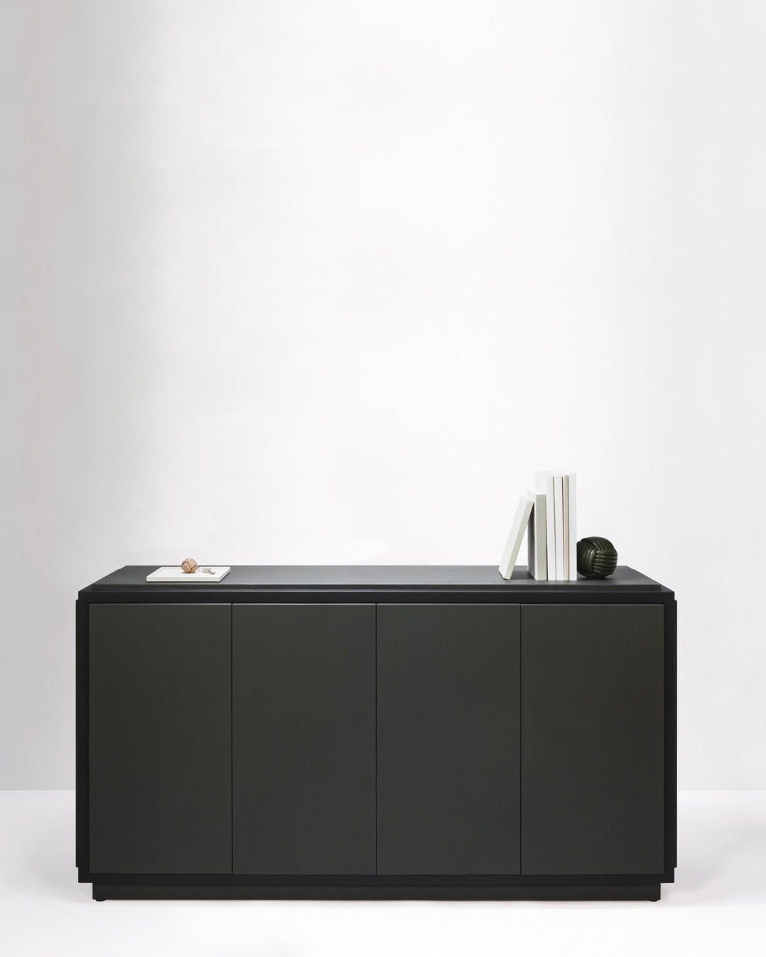 Black Vittoria sideboard with 4 doors by Giobagnara in minimalist setting