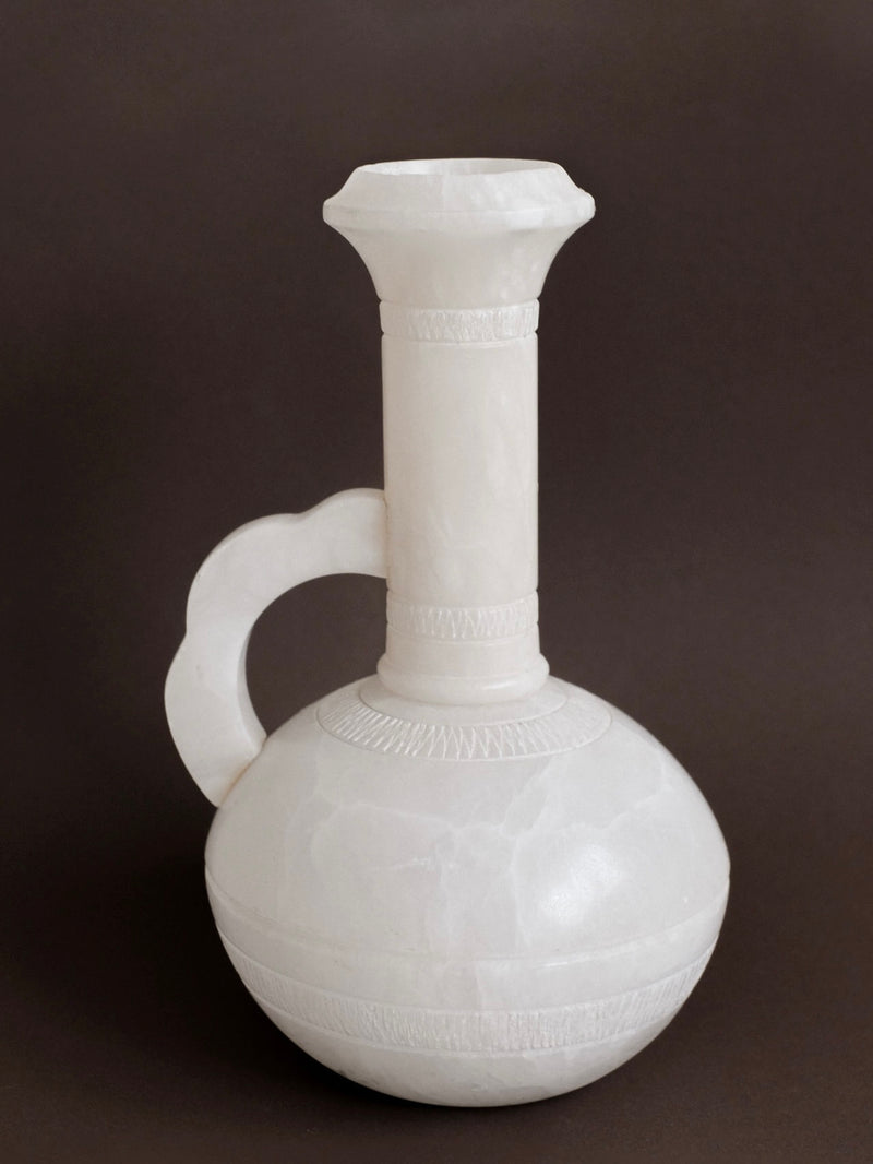 White alabaster vase with elongated neck and curved handle