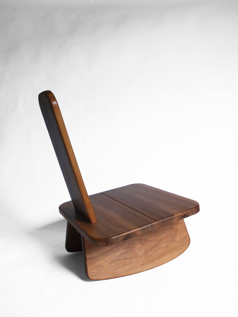 Mali walnut chair side profile showing curved backrest and base
