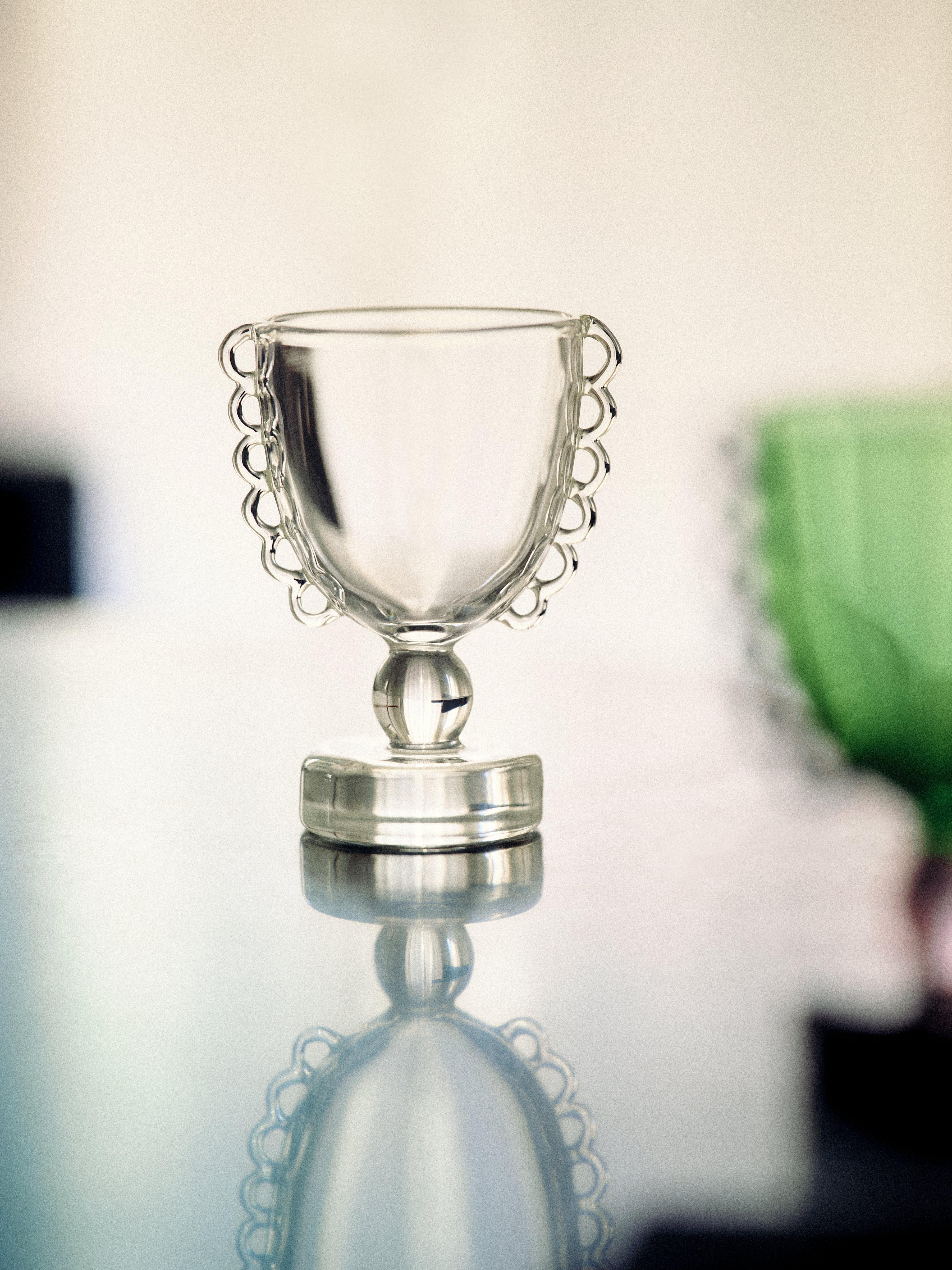 Coco Egg Cup Set — top view of clear glass cup on reflective surface