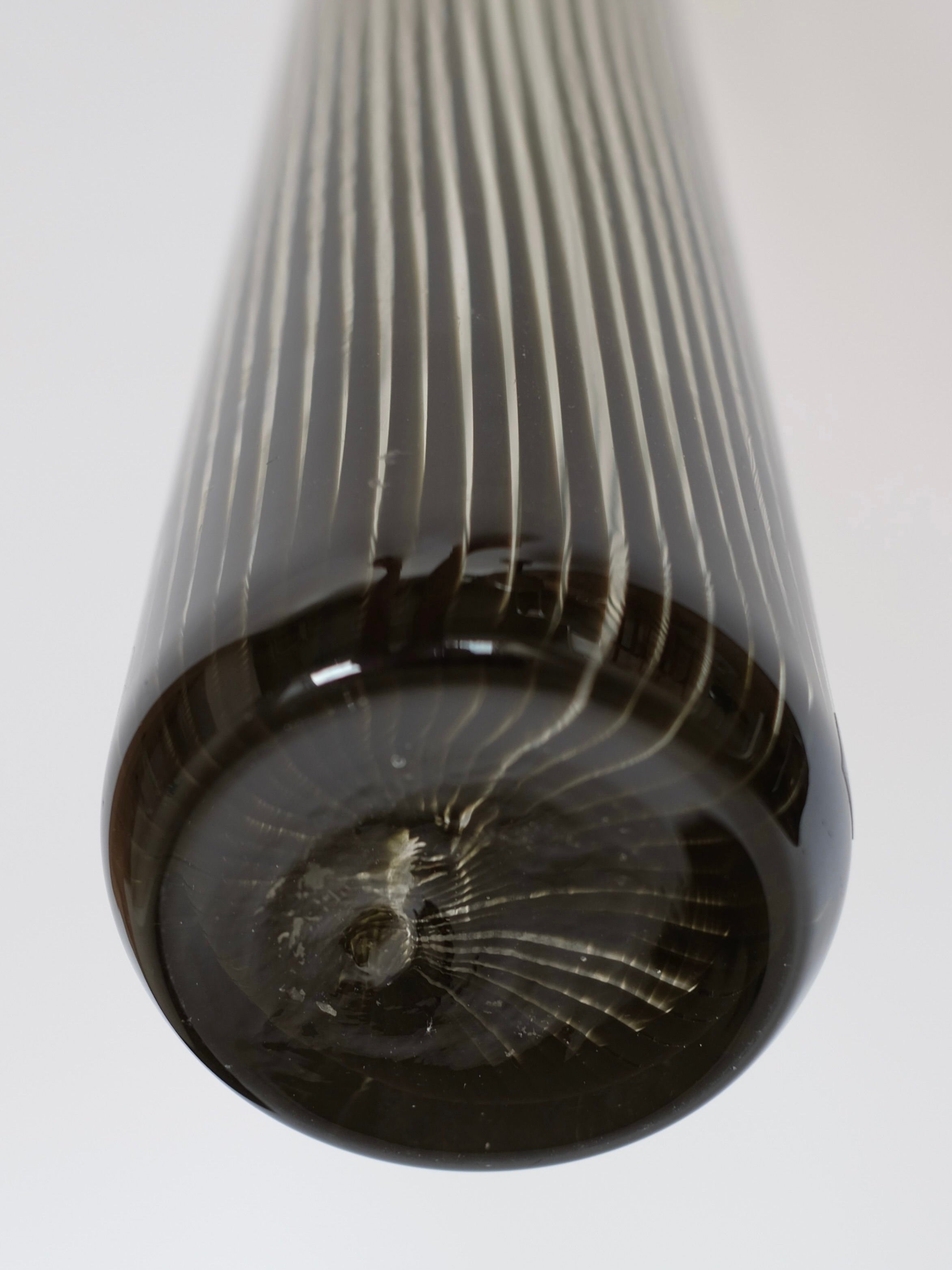 Experience a bottom-up perspective of the Italian Murano Vase, 1970 by septembre studios. This piece features intricate black and white striped patterns with a glossy finish that captures the essence of vintage Murano glass, highlighting the exquisite craftsmanship of Italian glasswork.