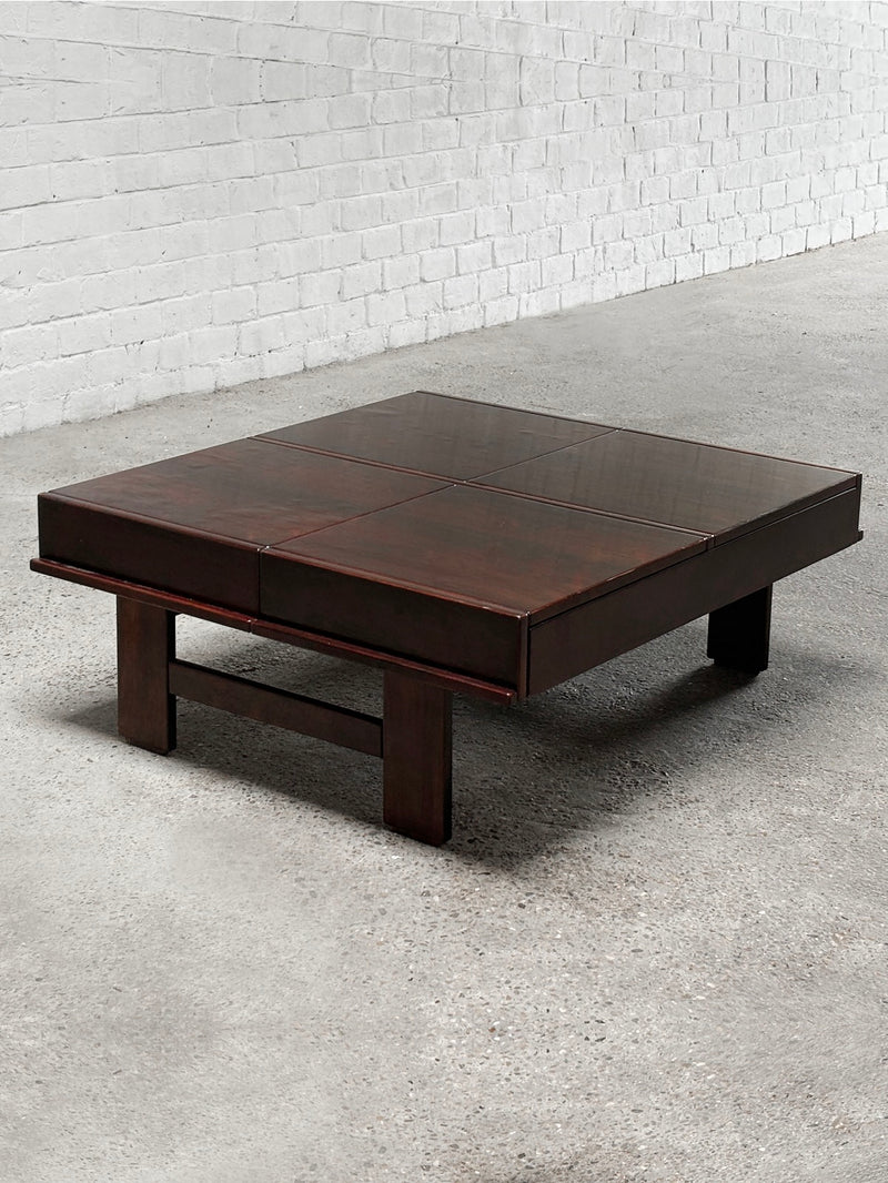 The Introverso Square Walnut Coffee Table by Michelucci, Italy 1970's, features a grid-patterned top and minimalist design. Its low-profile style complements concrete floors and white brick walls effortlessly.