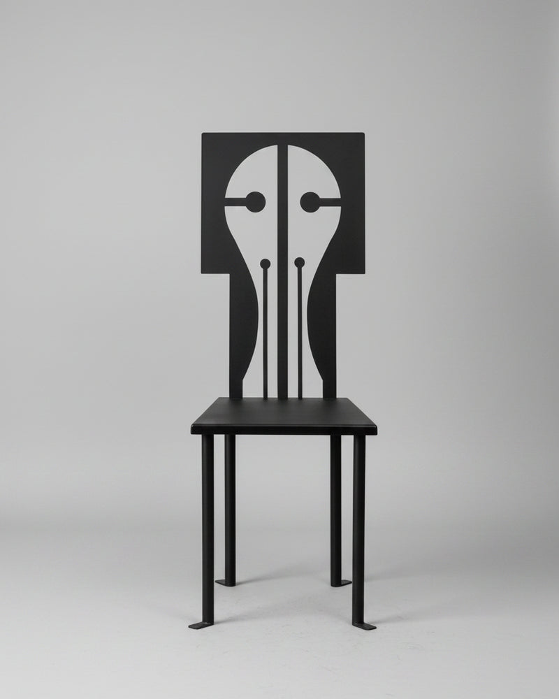 Black iron Epona chair with geometric face design backrest