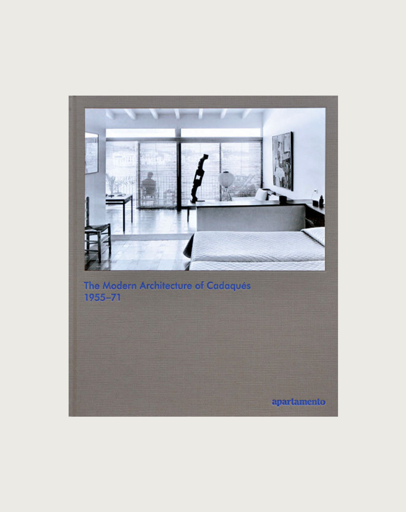 The book cover showcases a black and white photo of a modern interior with large windows and minimalist design, reflecting the creative relationships that shaped Cadaqués. The title reads "The Modern Architecture of Cadaqués: 1955-71" in blue text, set against a light grey background with "Maison Plage" at the bottom right.