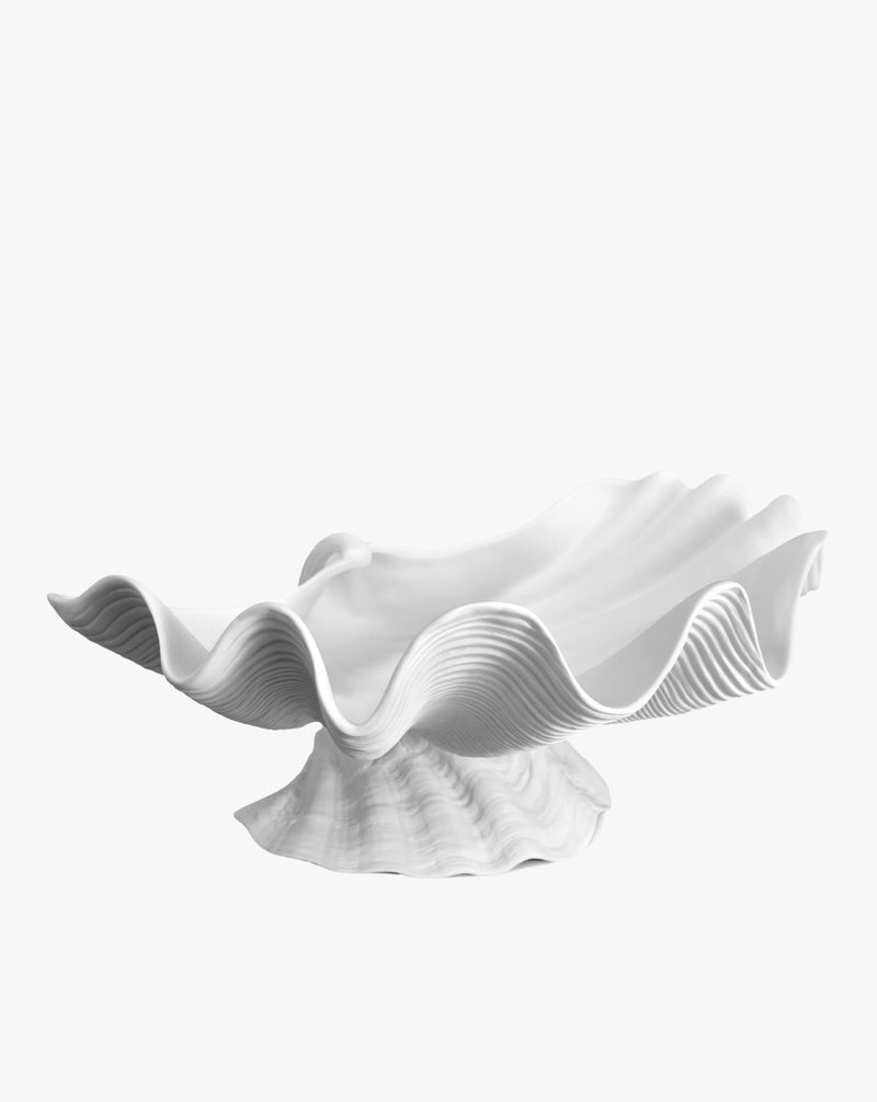An abstract white sculpture resembling flowing fabric with elegant ripples and folds from the LOBJET Atelier Collection, isolated on a white background.