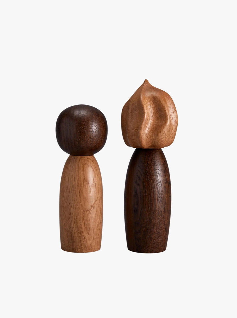 The Picanto Salt + Pepper Mills by LOBJET exude a minimalist design: one with a lighter, spherical head and the other darker with a flame-like texture. Ideal for adding contemporary flair to luxurious interiors.