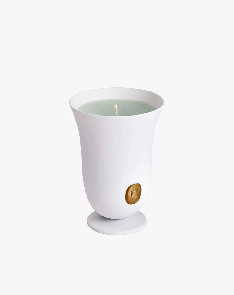 A LOBJET Bois Vert Candle in a ceramic container with a small, round, embossed logo near the base, featuring a single wick scented with Egyptian geranium, against a clean white backdrop.