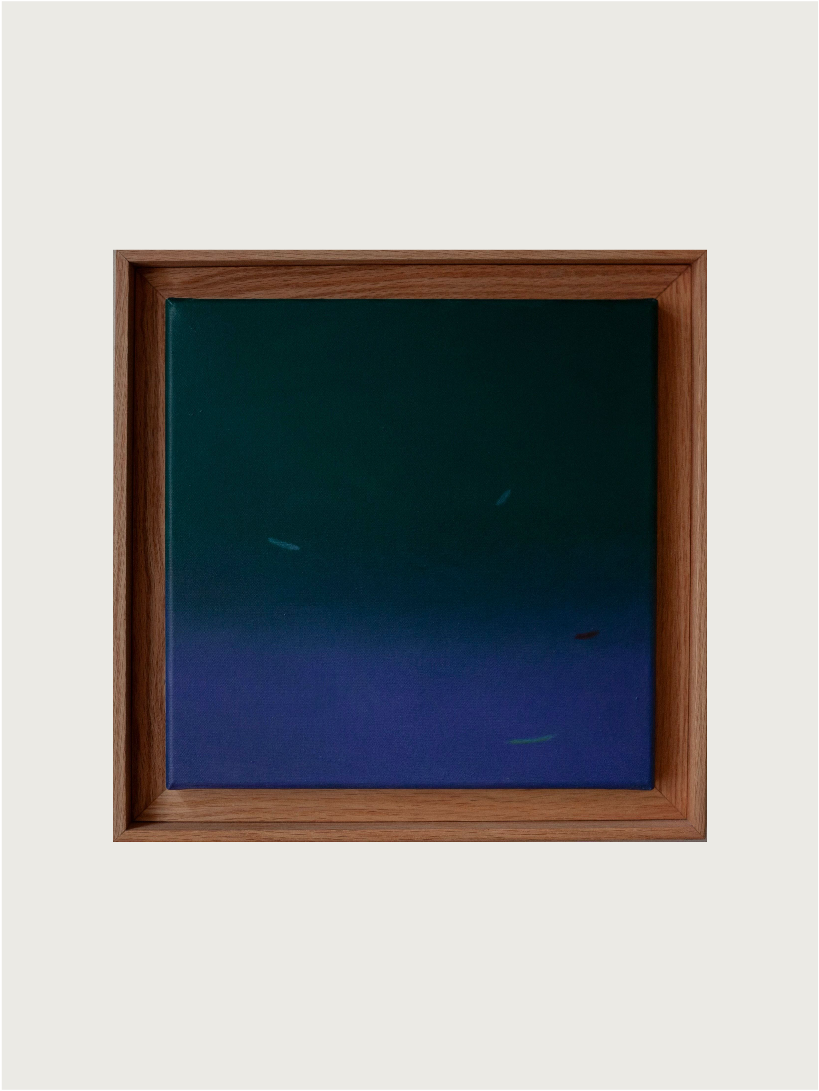 The "Fade into #2, 2024" painting by Rebecca von Matérn features an abstract design with a gradient of dark green to deep blue hues on a 36x36 cm canvas. It is encased in a shadow frame crafted from hard wax oiled oak, highlighting the subtle and minimal brush strokes against the contrasting background.