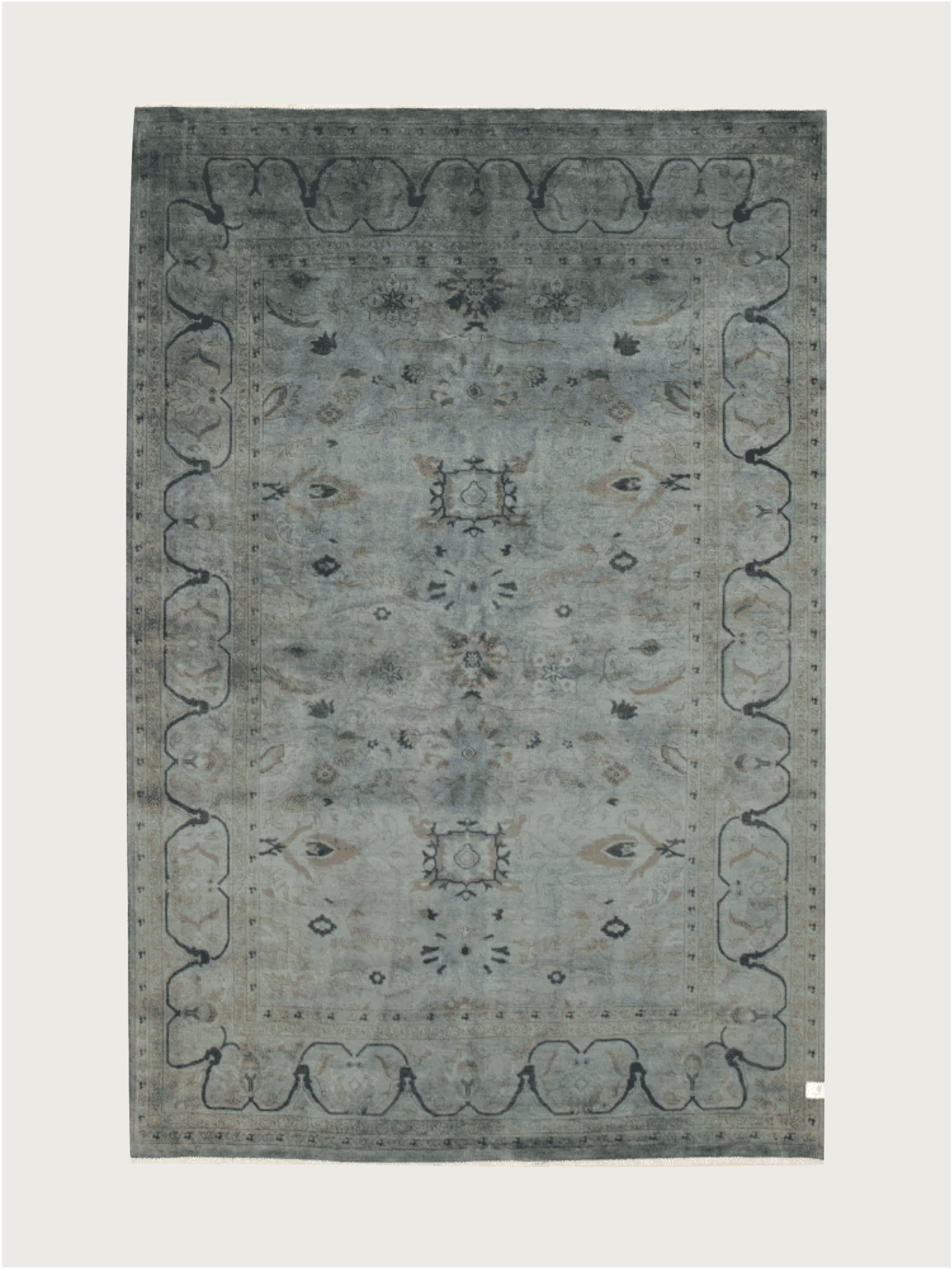 The Overdyed Rug in Indigo by catalog:three is a rectangular, hand-knotted piece measuring 183 x 274 cm. It boasts a vintage-style with a faded blue-gray hue, intricate floral patterns, scalloped border designs, and subtle motifs for an elegant and classic look.