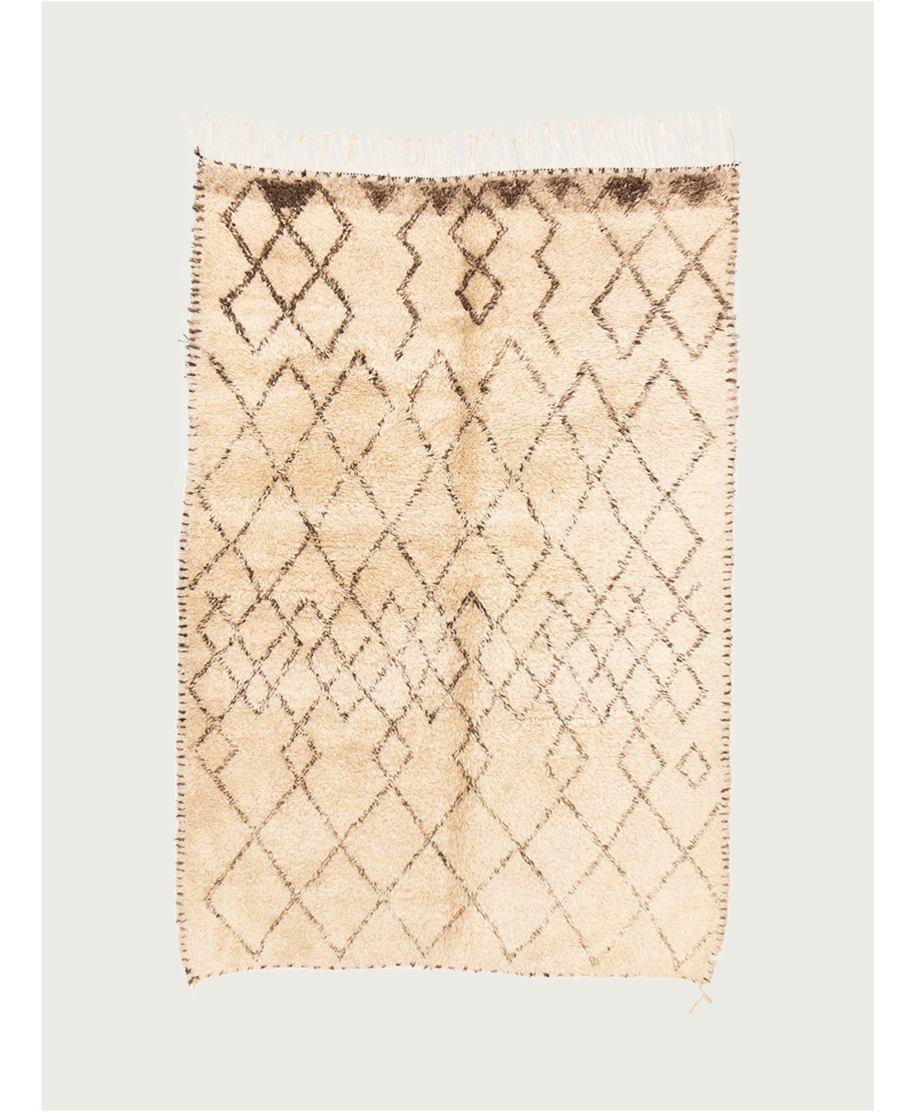 The Moroccan Berber Rug by catalog:three, measuring 196 x 295 cm in ivory, features a geometric pattern of interlocking diamonds and zigzags in darker brown with fringe on two sides. Its textured surface gives it a handcrafted Beni Ouarain style appearance.