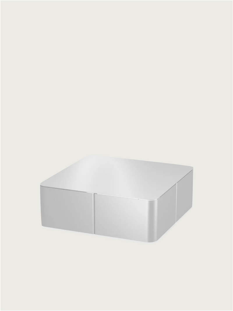 The PARCTA 'Gadroon' Aluminium Coffee Table features a sleek, minimalist silver rectangular design with rounded edges and a reflective finish, echoing the refined aesthetic of premium aluminium side tables.