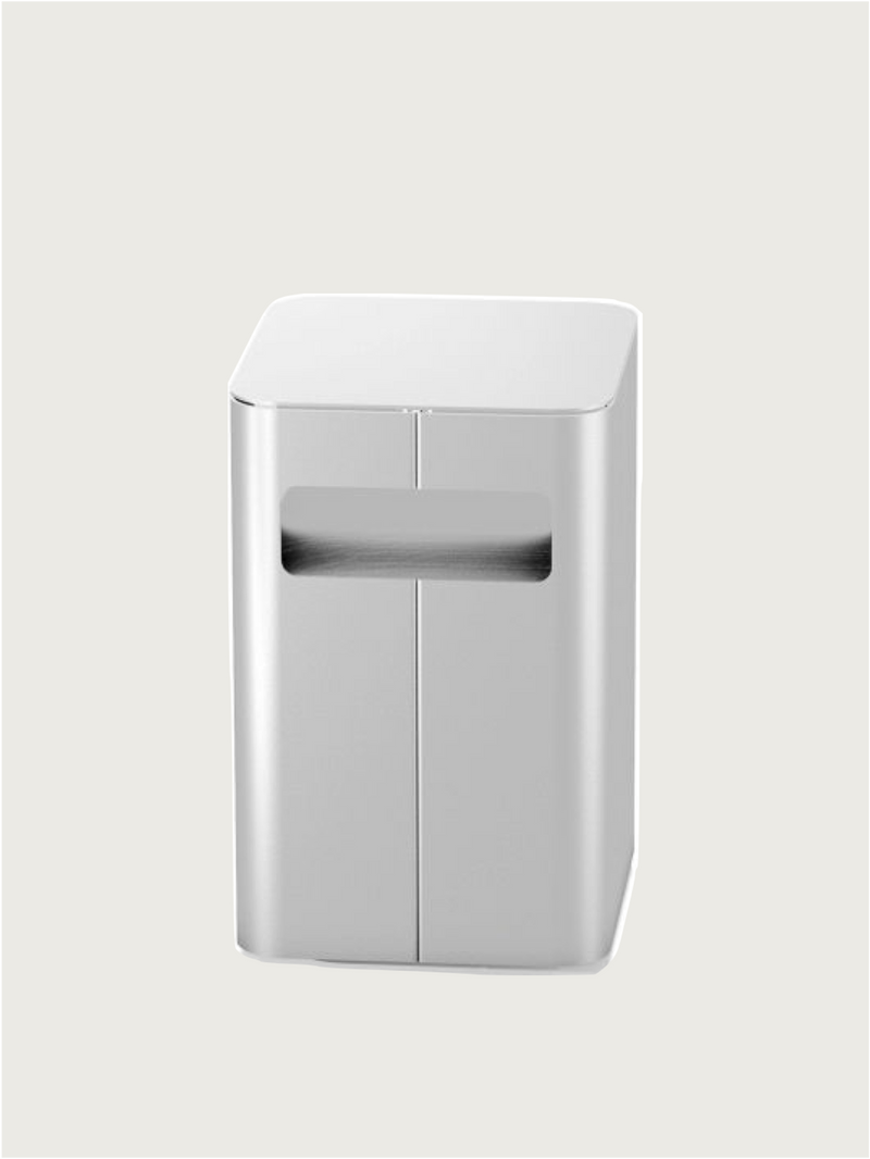 The PARCTA 'Gadroon' Bedside Table is a sleek, modern aluminum piece featuring a central rectangular slot and smooth, rounded edges, shown against a plain light background.