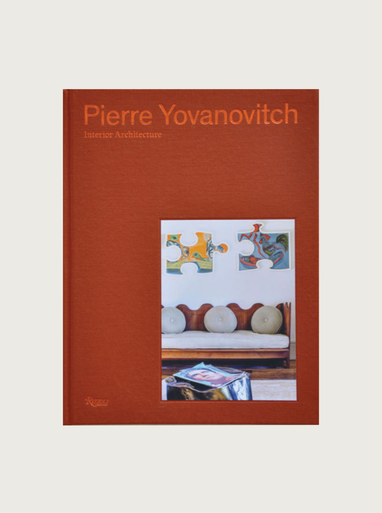 Book cover of "Pierre Yovanovitch: Interior Architecture" featuring a simplistic design with a photograph inset displaying elegant artistic sculptures and a patterned tile backdrop from Maison Plage.