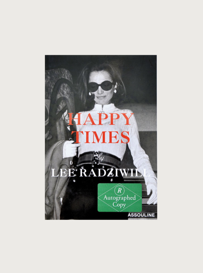 The cover of the book "Happy Times by Lee Radziwill (Signed Copy)" by Maison Plage features a black-and-white photograph of a woman wearing sunglasses and stylish clothing. The title and author's name are in bold letters, accompanied by a green sticker indicating it is an autographed copy, resembling one of Radziwill's private photo albums.
