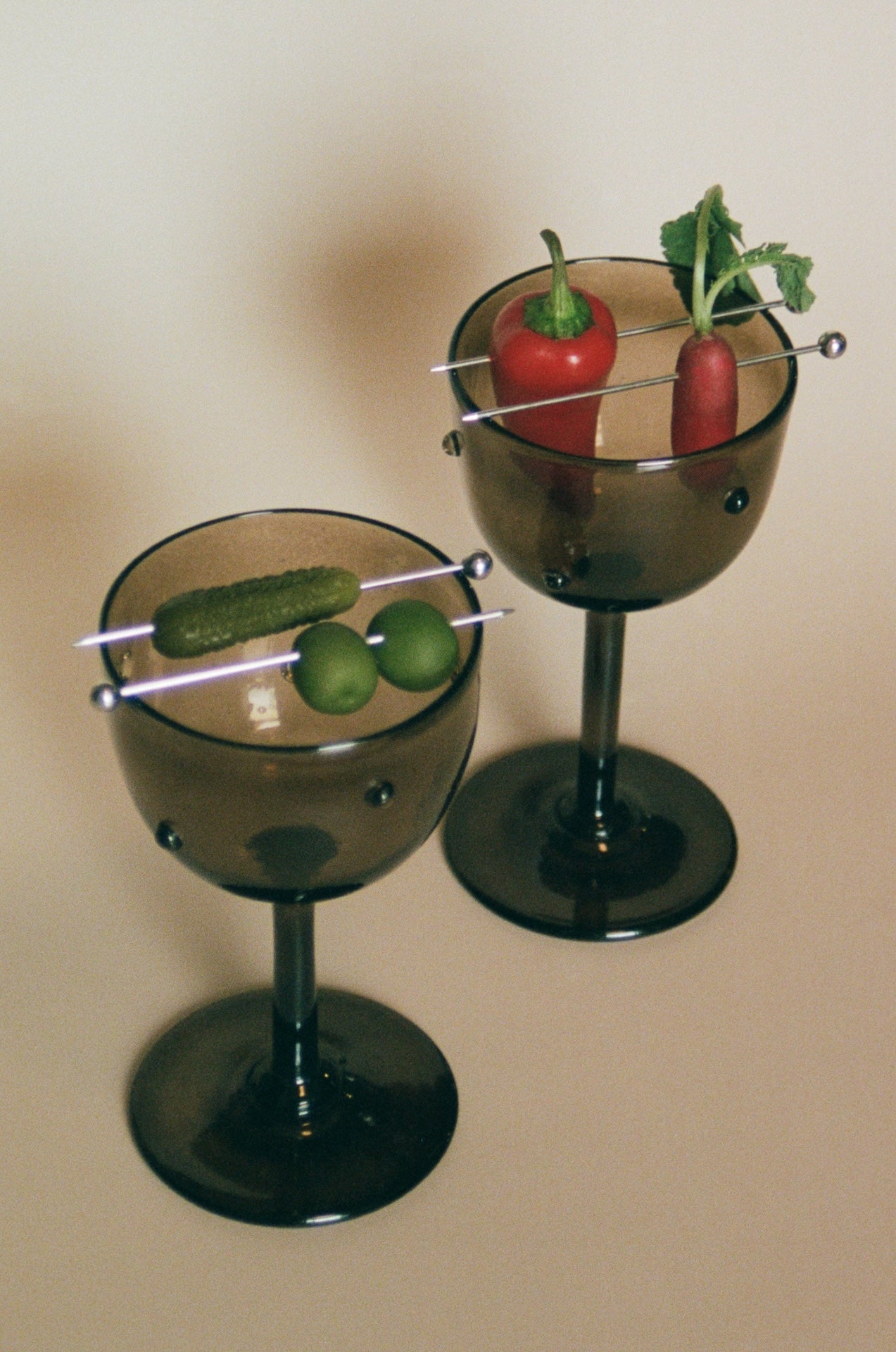 NOA GOBLET cocktail Glass — back view with garnish on dark glass