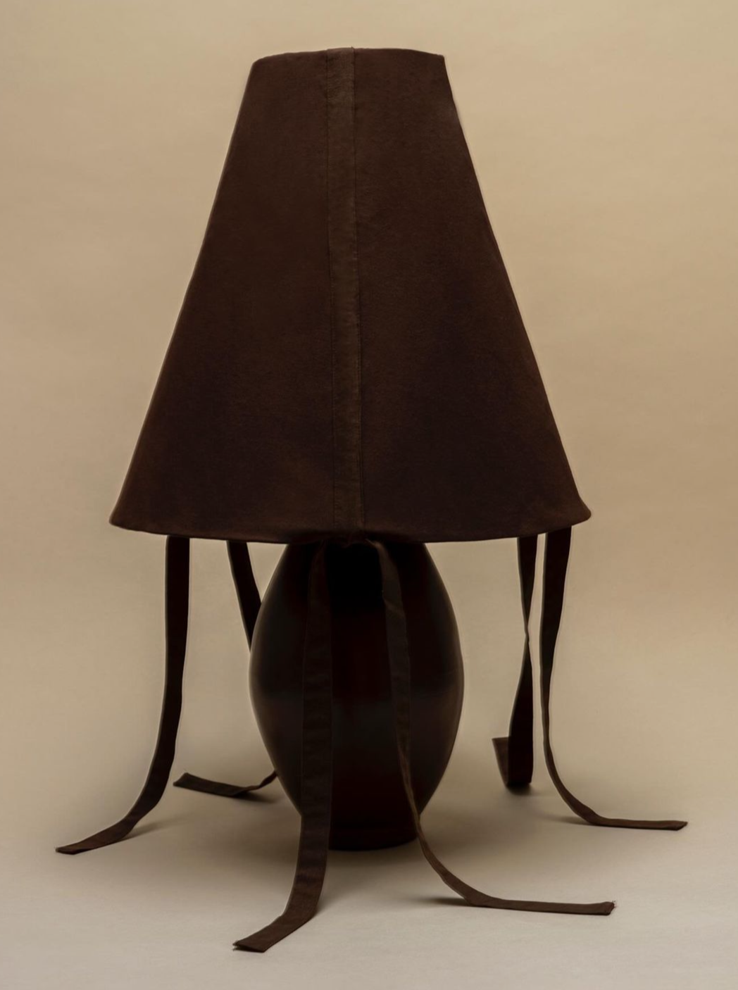 Brown-ceramic-large-lamp-on-wooden-table-in-modern-living-room