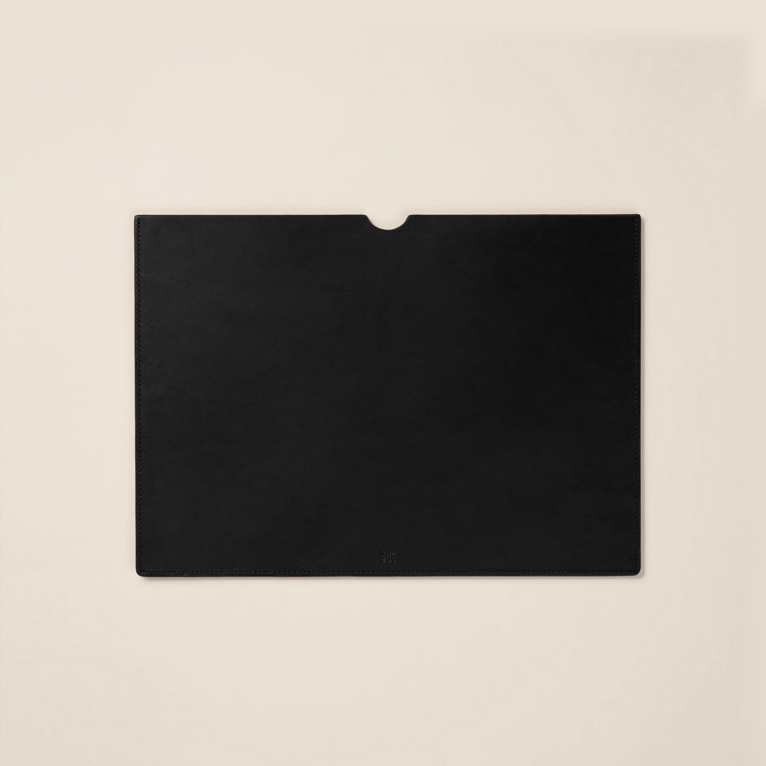 Leather Laptop Sleeve — top view on neutral background