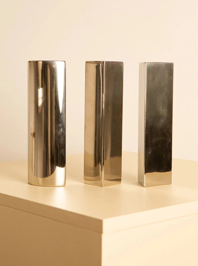 Set of three vintage metal vases in 80's style, perfect for home decor 