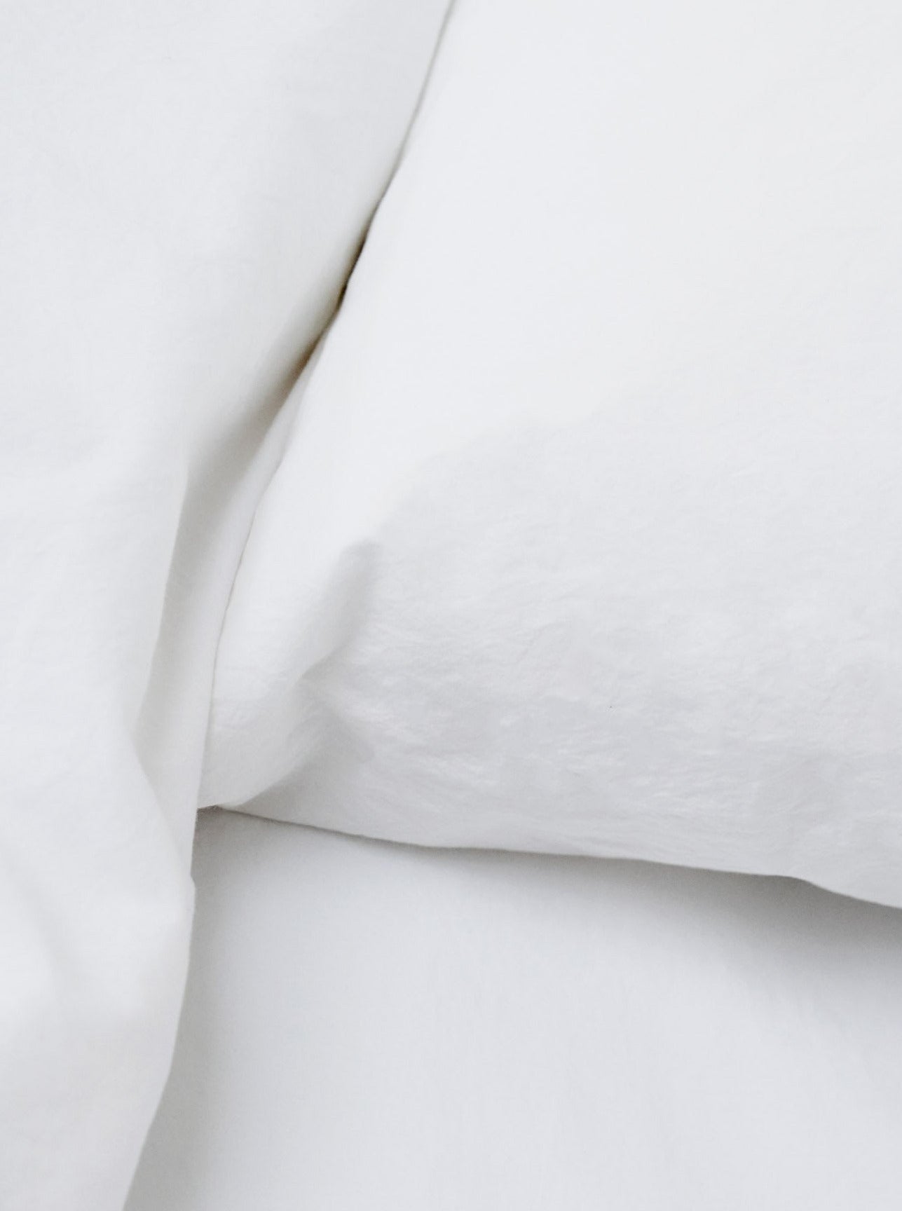 White Washed Cotton Percale Bed Set — side angle showing soft white fabric