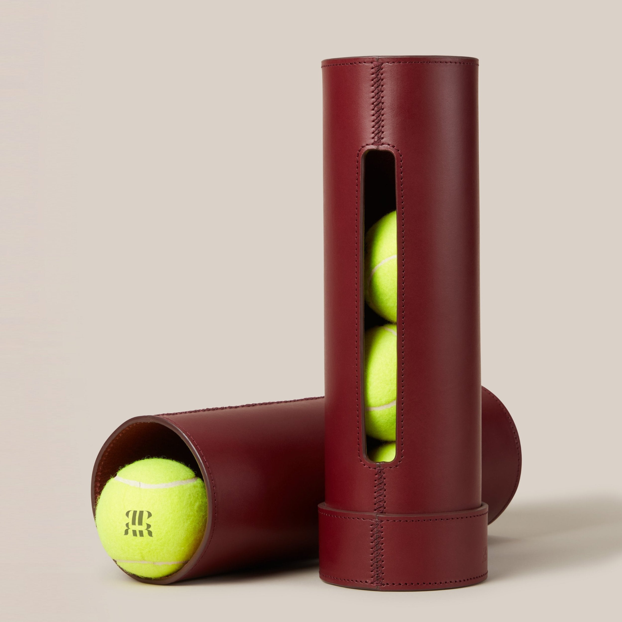 Leather Tennis Ball Holder — close-up of burgundy leather with tennis balls