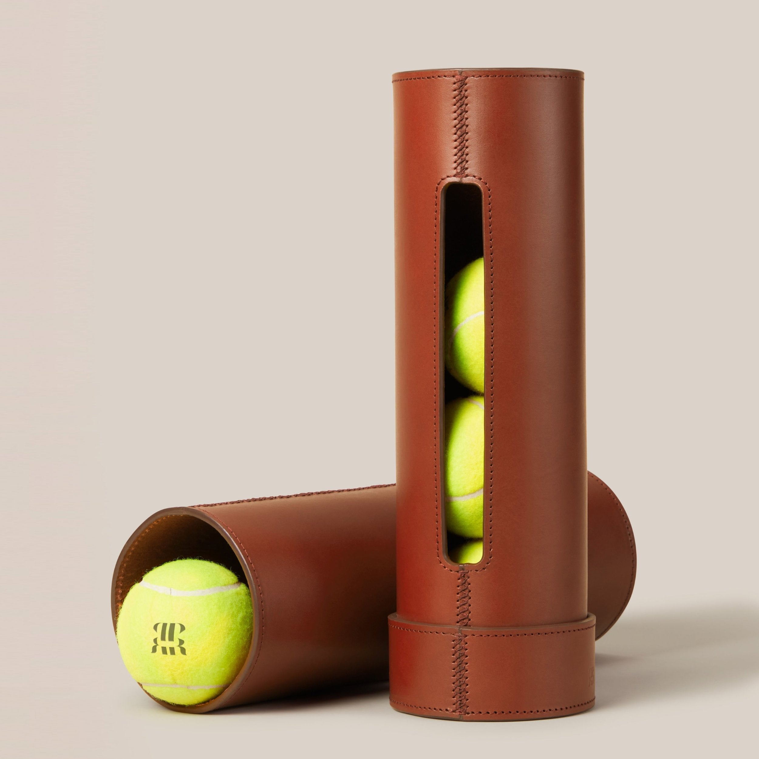 Leather Tennis Ball Holder — side view of brown leather with tennis balls