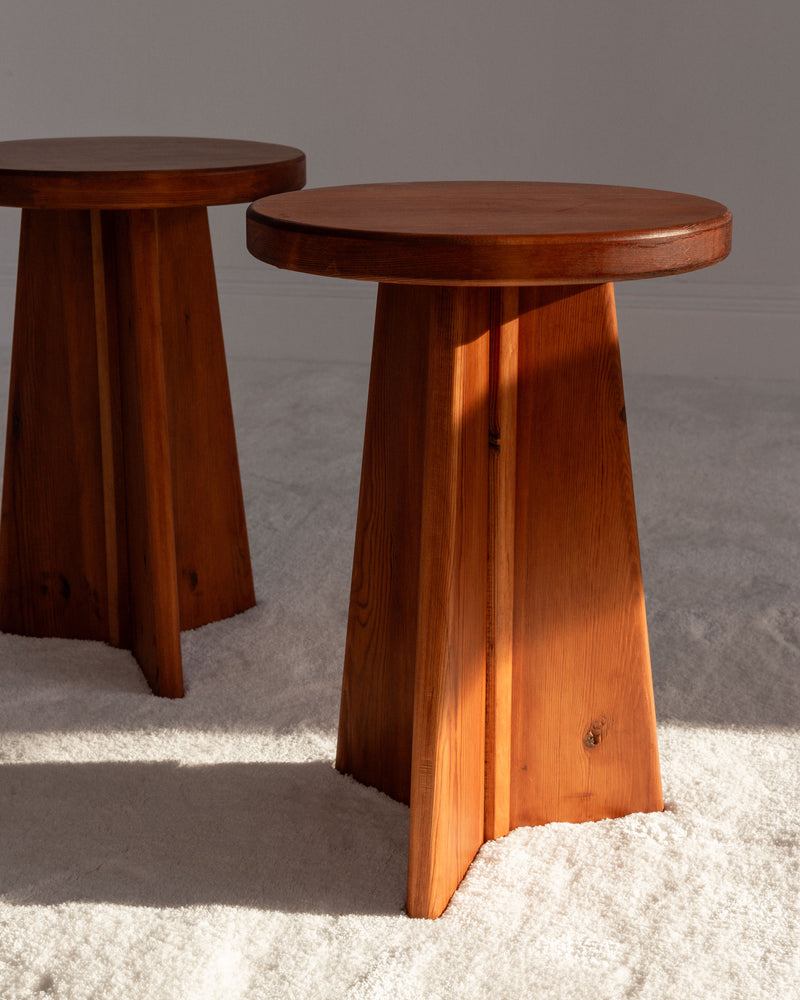 Vintage Swedish pine stools with tapered legs on concrete floor