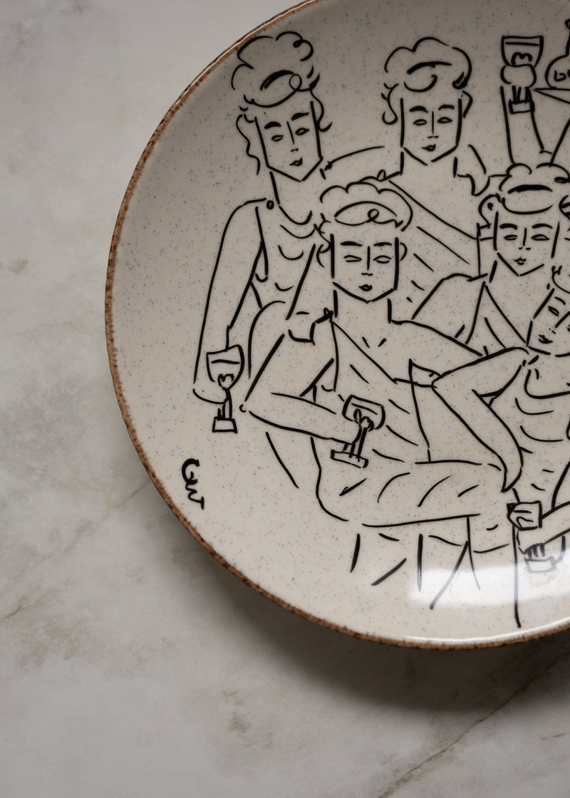 Hand-drawn figure illustrations on cream ceramic decorative dish