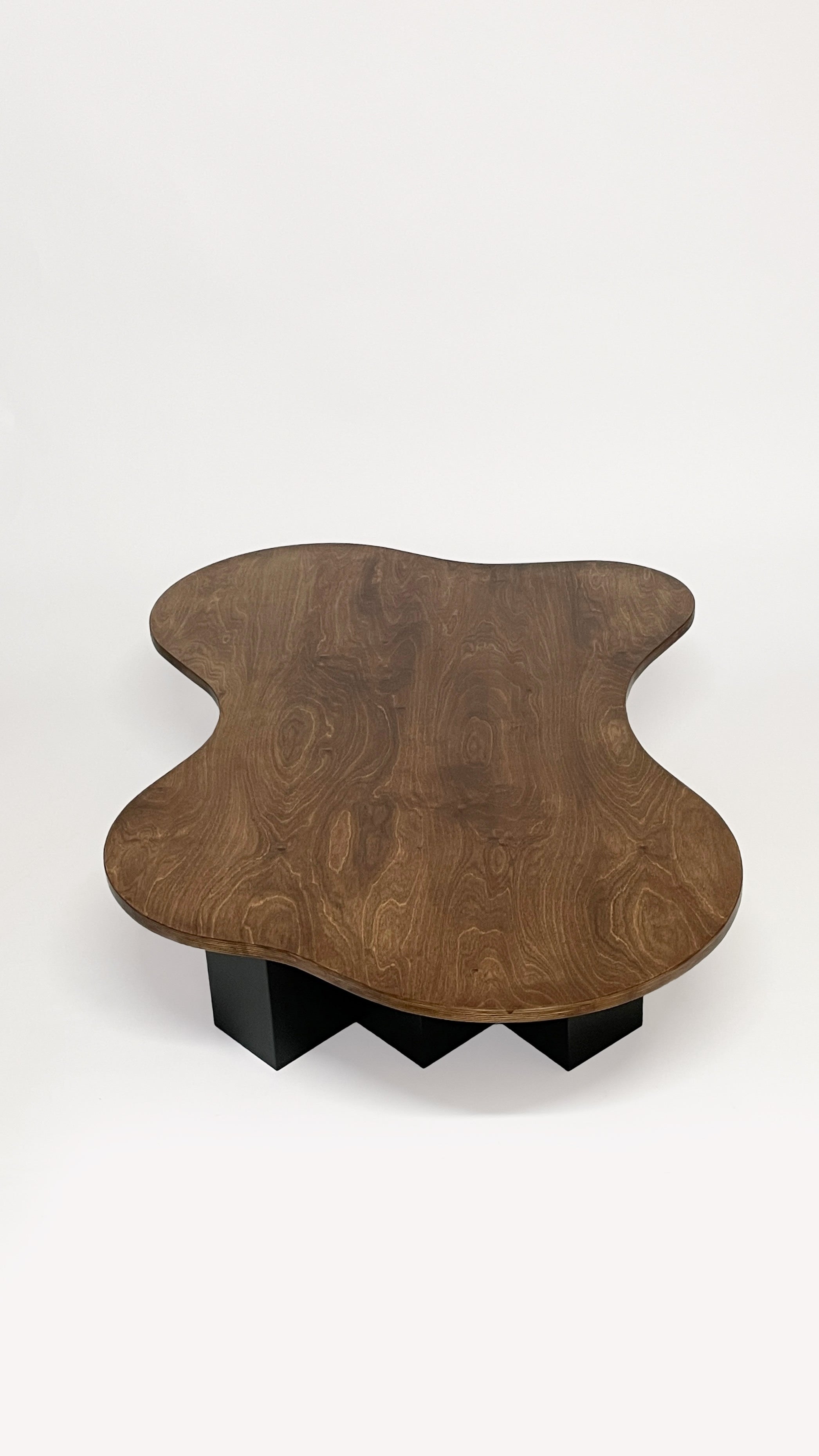 Spill Table - Oak Black by Goons — side angle showing organic shape and wood grain