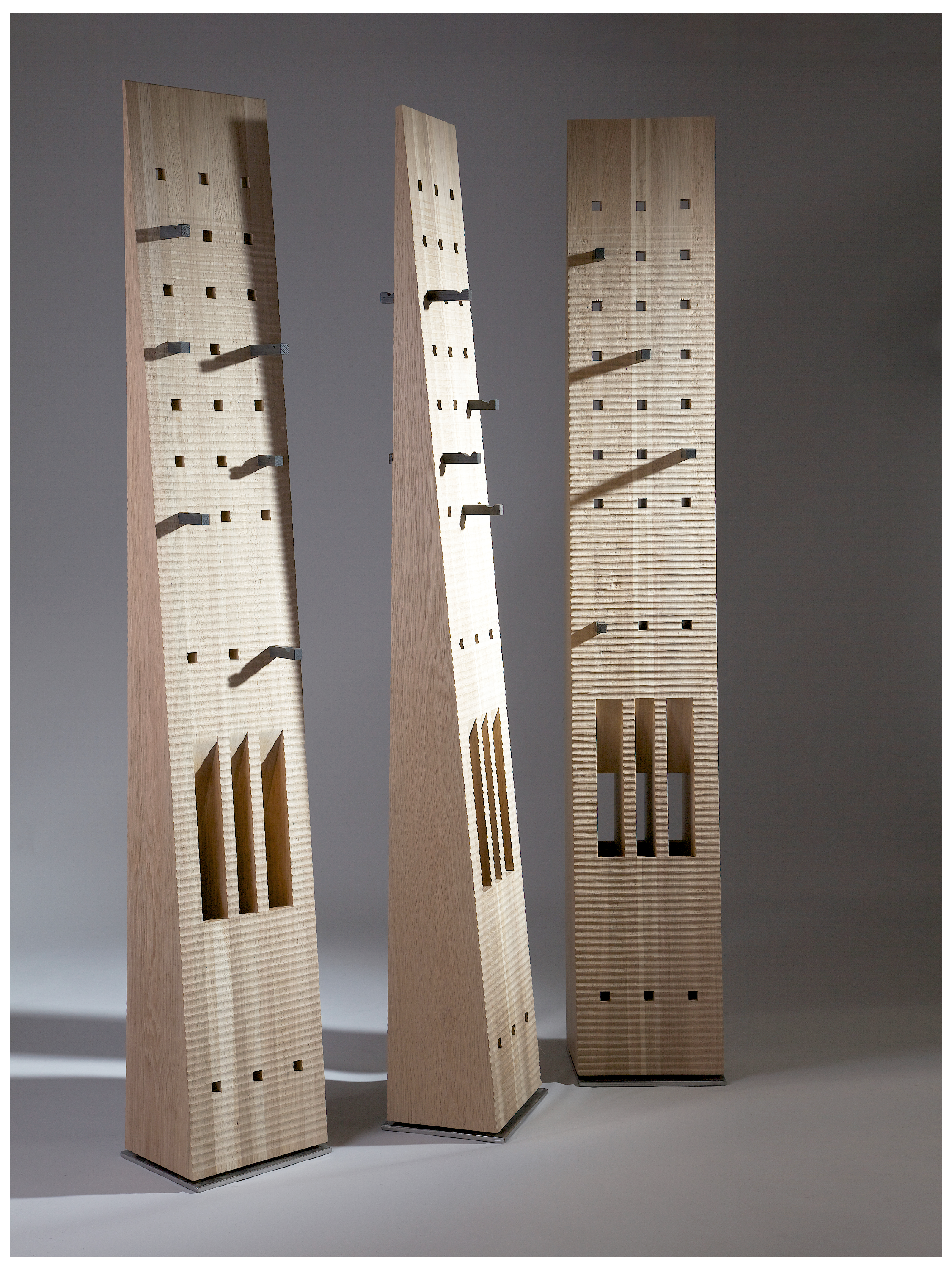 Totem Coat Stand - Oak and 5500 years old Bog Oak — angled view highlighting wooden structure and hooks
