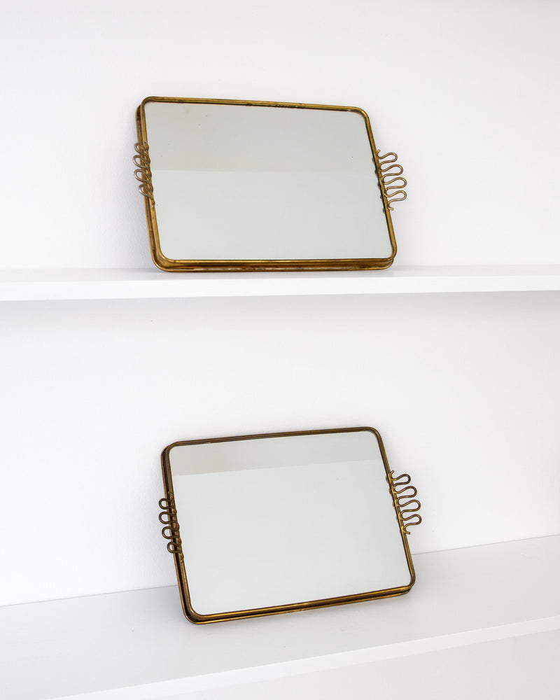Pair of Scandinavian Modern Brass Mirrored Trays, 1950s–60s — close-up of mirrored surface with brass accents