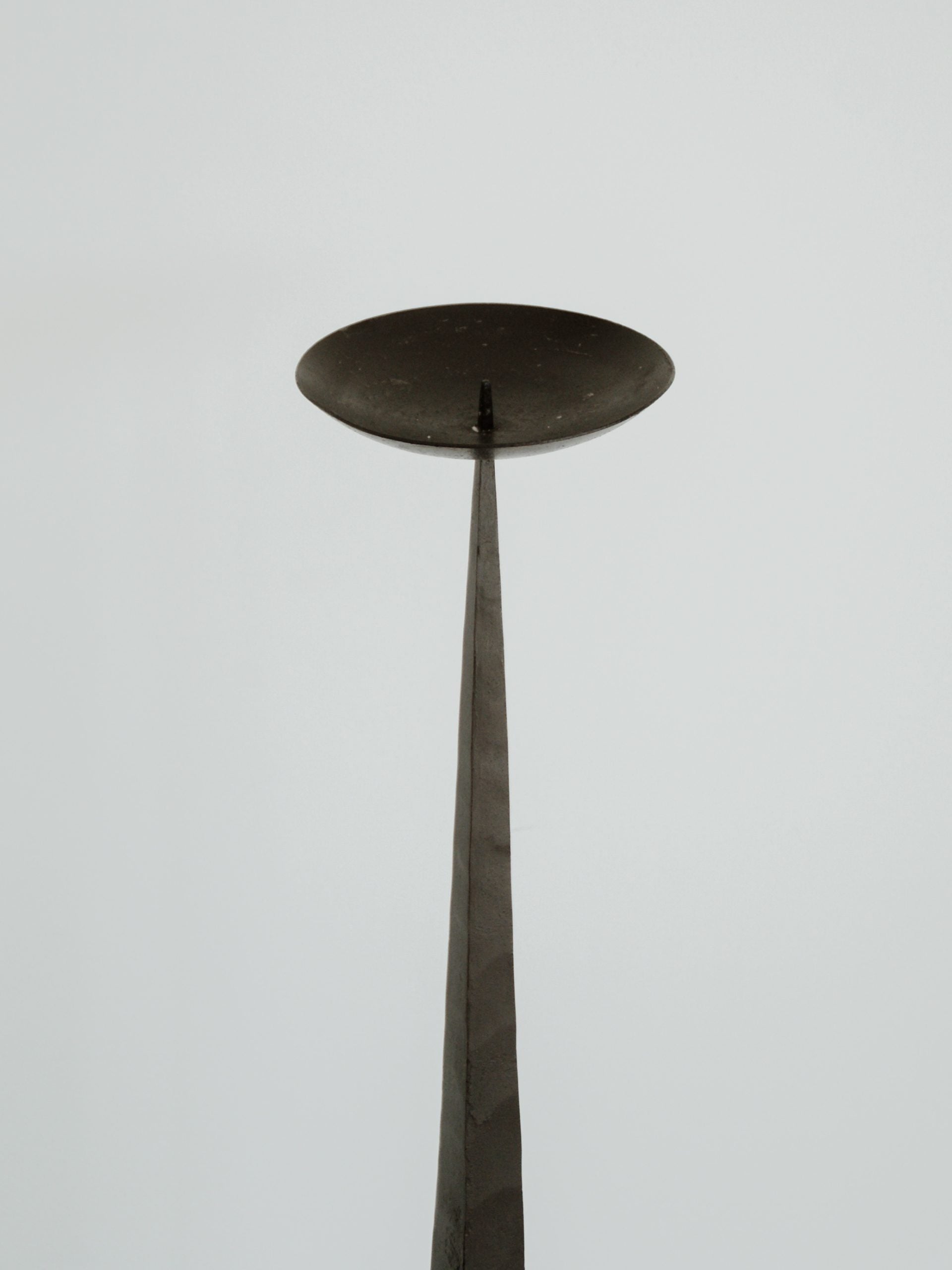 Brutalist Tall Metal Candlestick — close-up