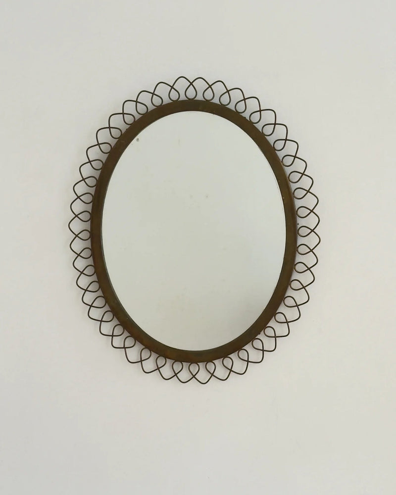Sculptural Brass Mirror — close-up of brass frame detail