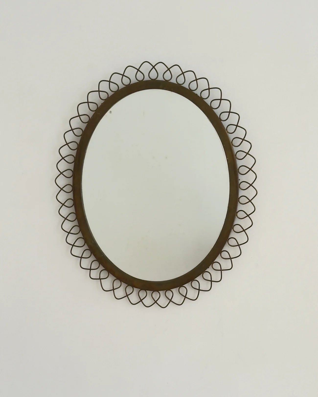 Sculptural Brass Mirror — close-up of brass frame detail