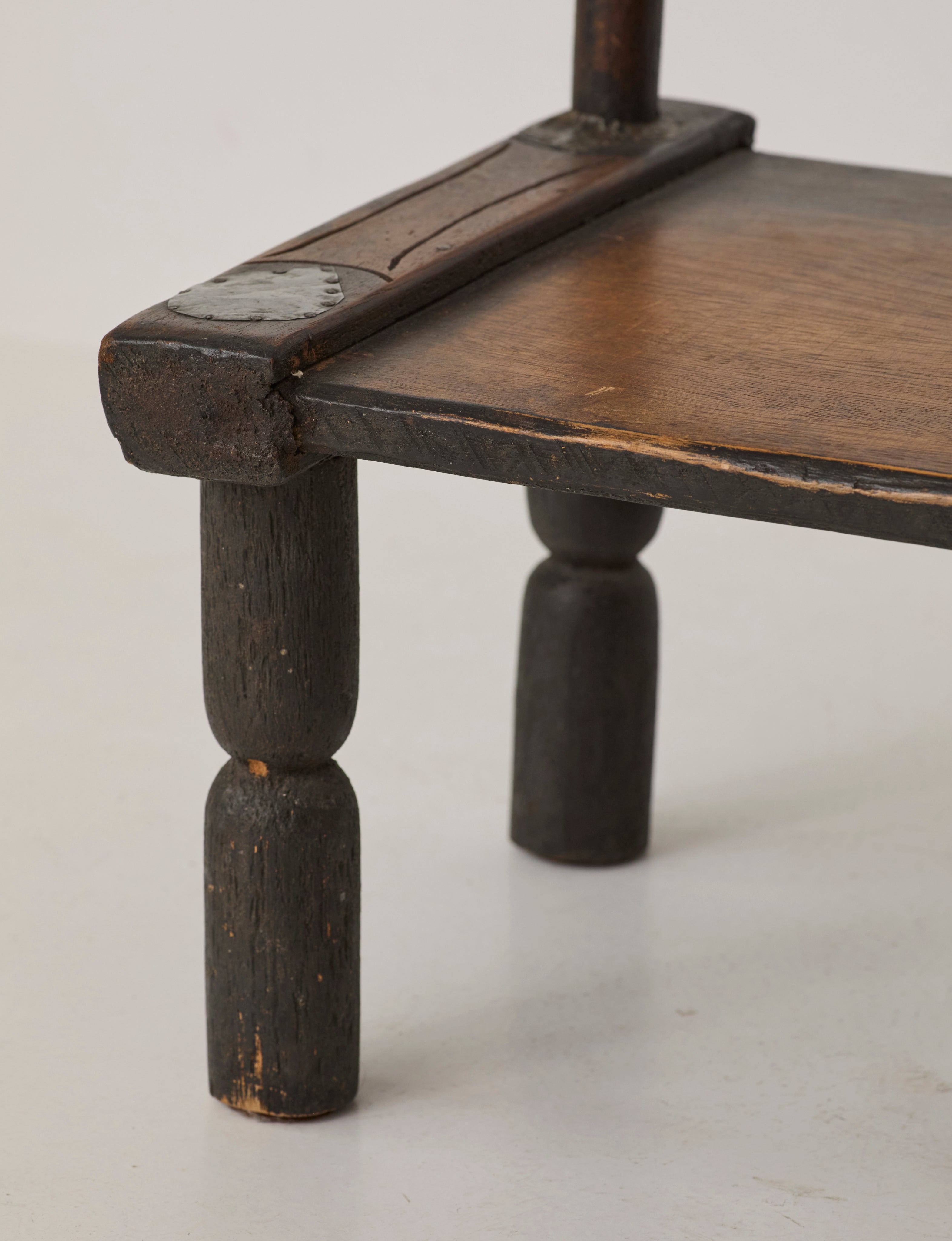 Small artisanal vintage West African chair "Baoulé" in solid wood C. 1960 — in context