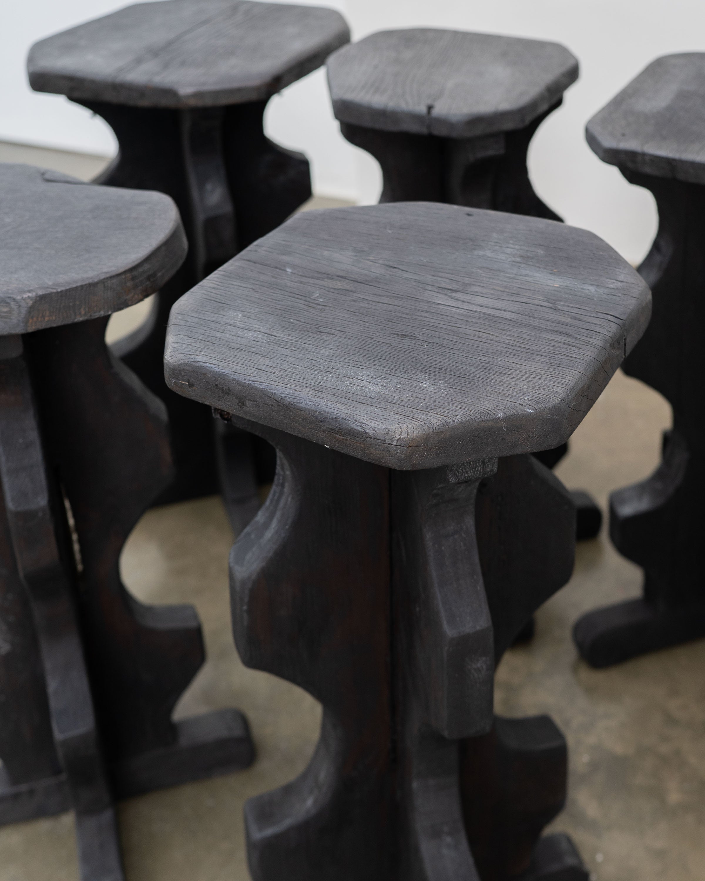 Sculptural Brutalist Bar Stools — close-up of dark wood texture