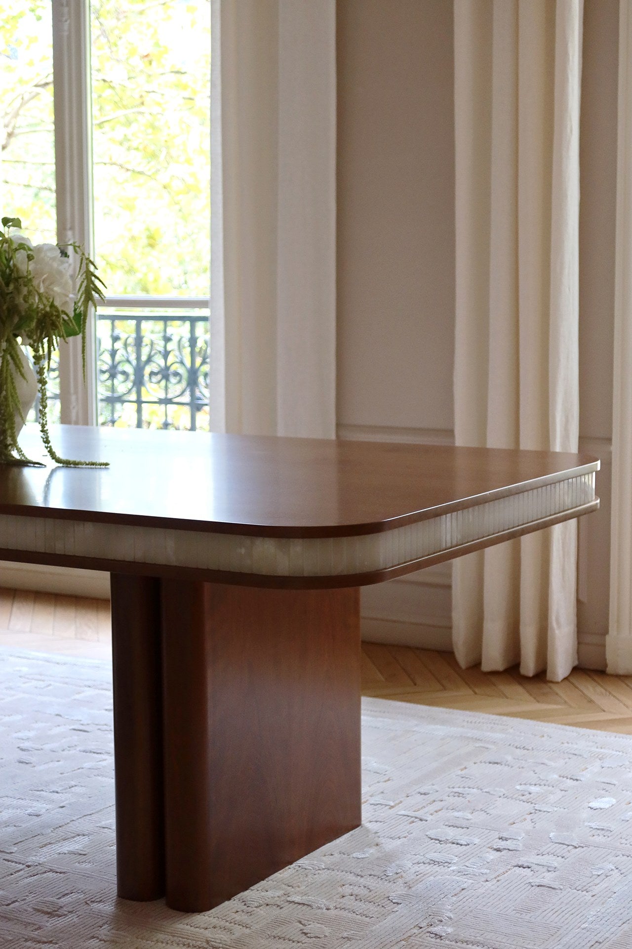 Doppio Wood And White Onyx Dining Table — side view in bright room