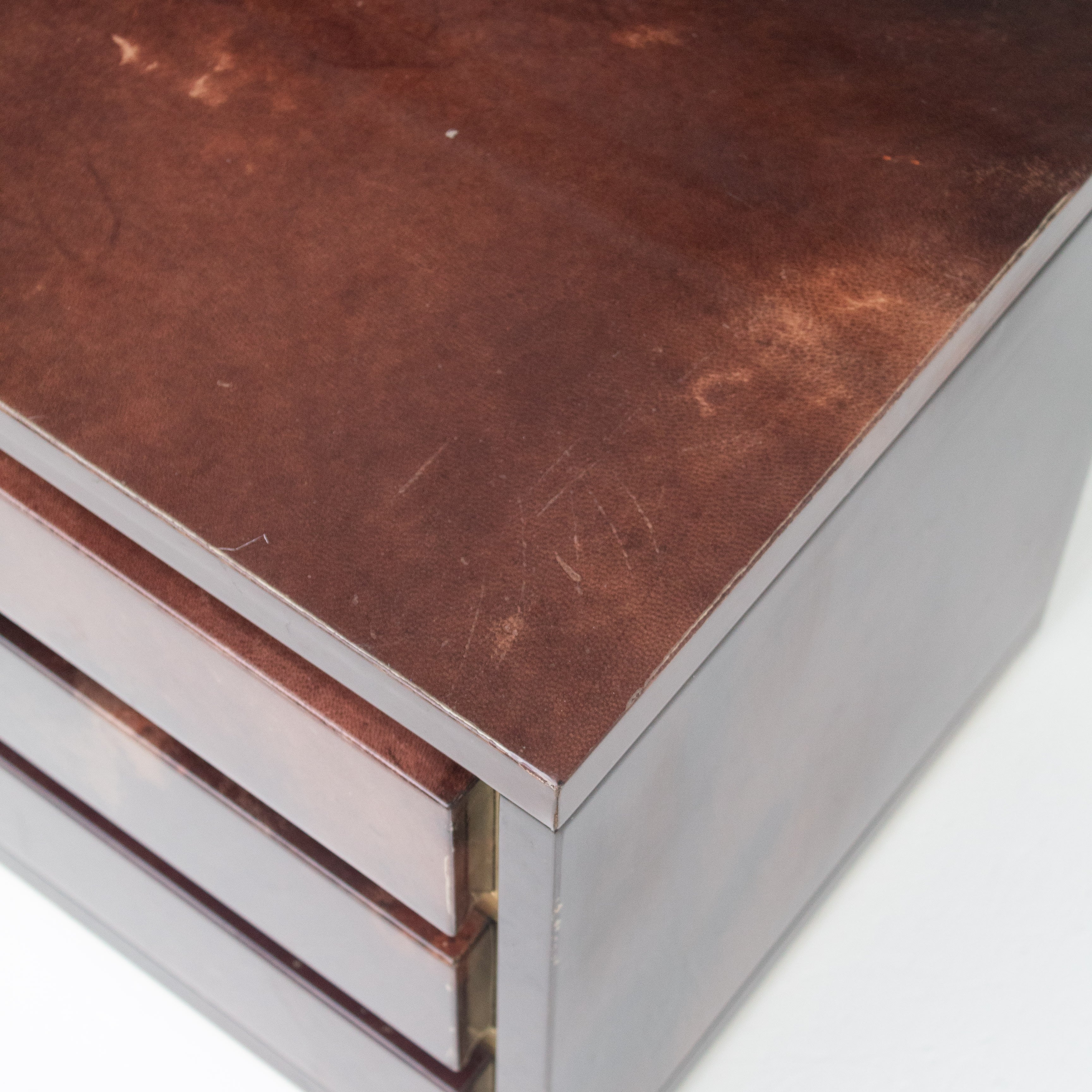 Pair of Aldo Tura (attr) Nightstands in Parchment and Brass — close-up of parchment surface with brass accents