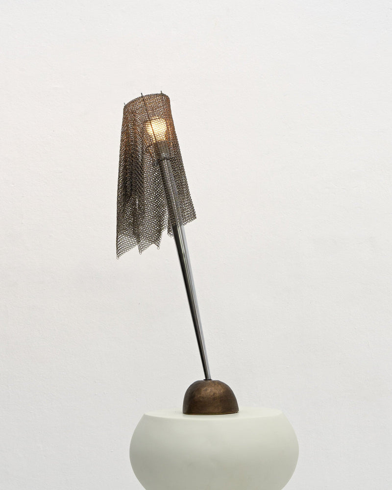 Ecate table lamp with mesh shade by Toni Cordero for Artemide