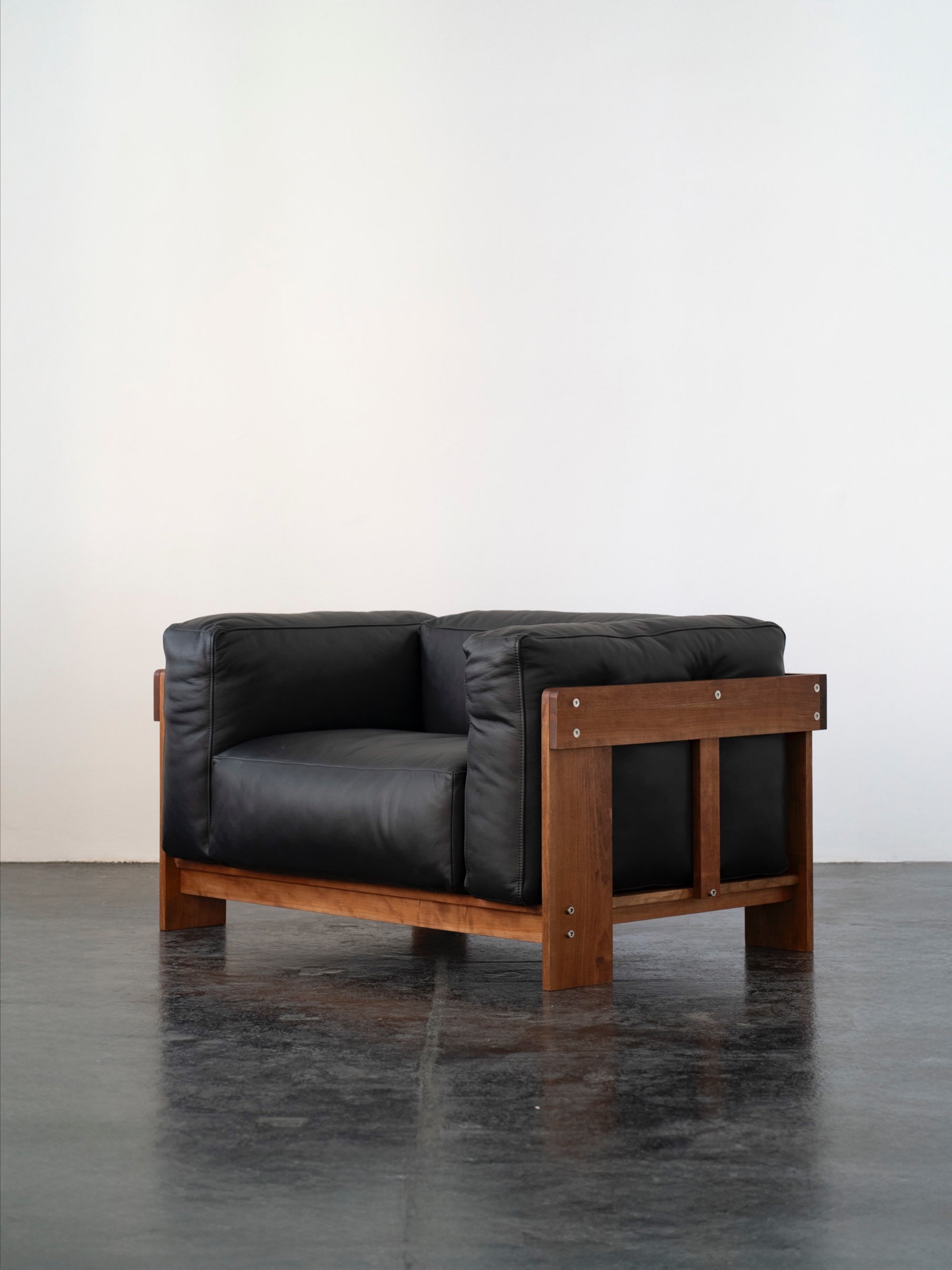 Overlap Lounge Chair | DN_S2503 by SUPER95 | The Oblist — black leather, wooden frame