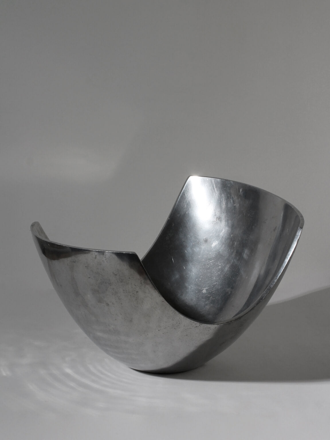 Polished Aluminum Asymmetric Contemporary Large Deep Bowl — top view highlighting shiny surface