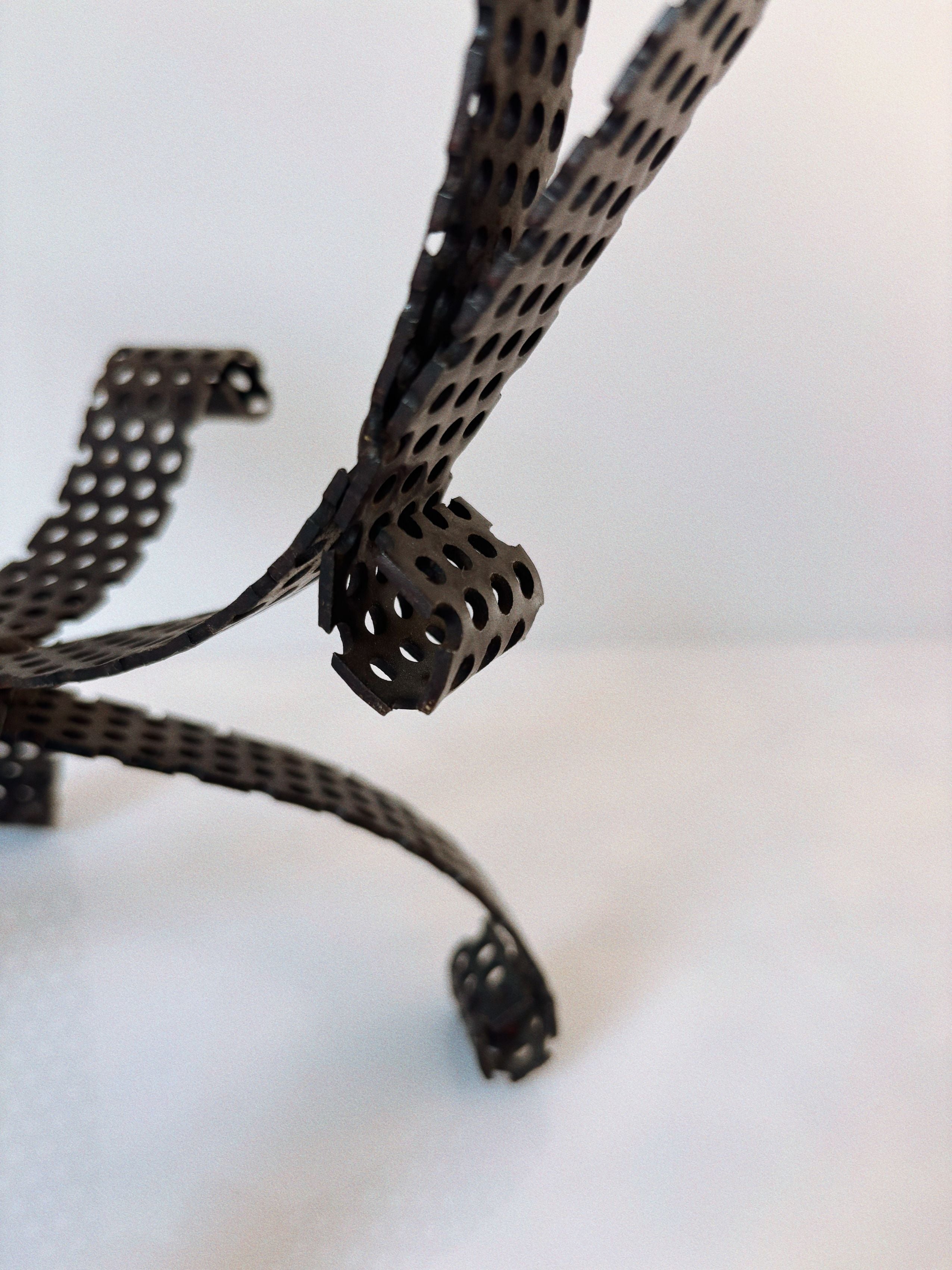 Handmade Metal 3 Arm Candleholder, Poland — close-up of perforated metal design